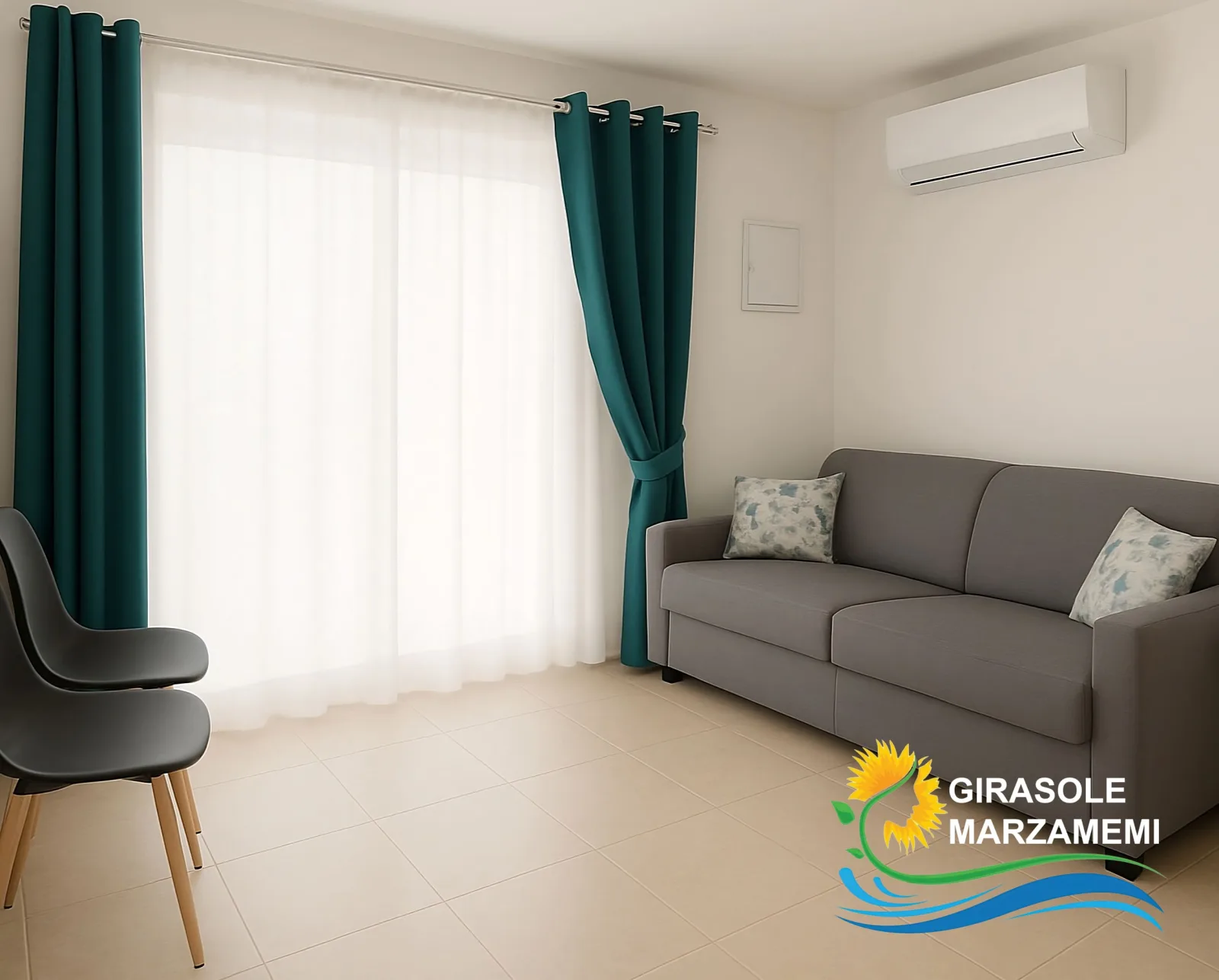 Soggiorno con divano letto dell'Appartamento Girasole a Marzamemi